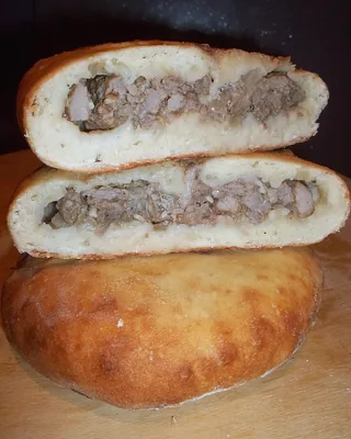 A Svan kubdari cut open to show the spiced meat filling inside the bread