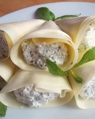 Sulguni rolls filled with nadughi cheese and mint leaves
