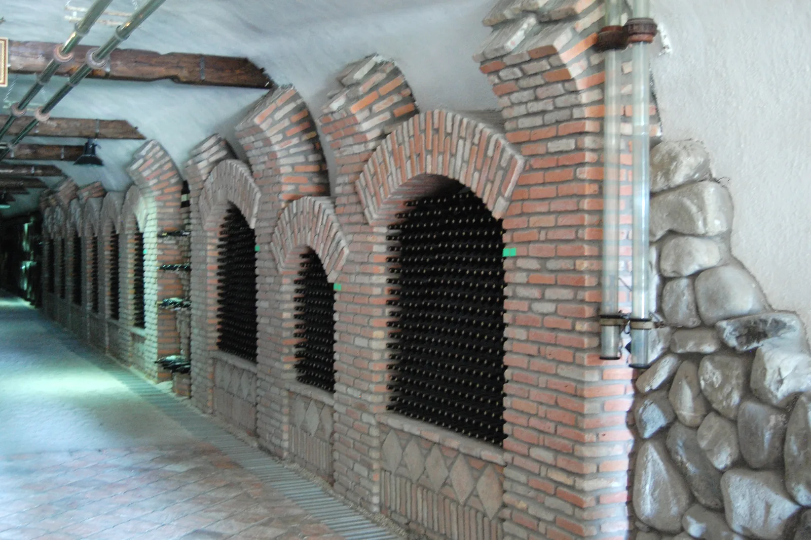 A brick-arched tunnel lined with bottle niches at Khareba, Kvareli