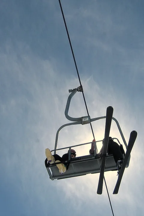 A chairlift at Gudauri against the winter sun