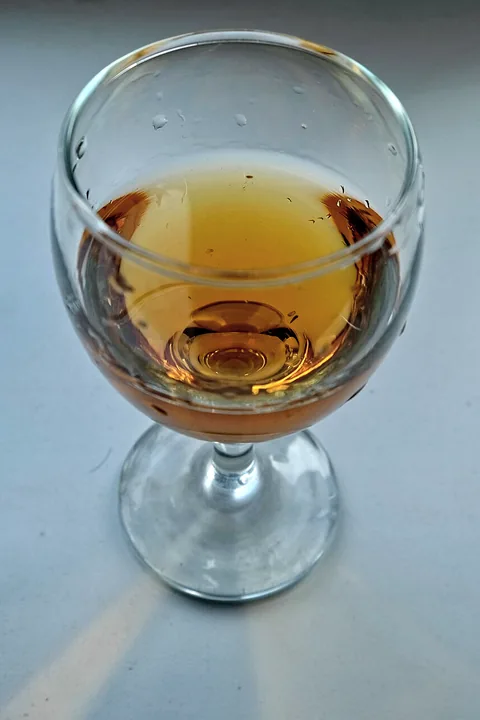 A glass of amber qvevri wine